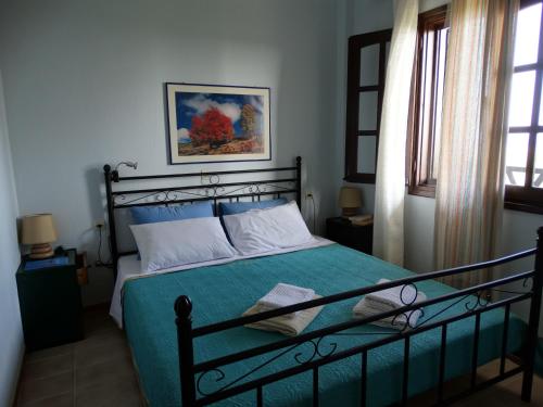 Krevet ili kreveti u jedinici u okviru objekta Apartments Karpetis a green paradise