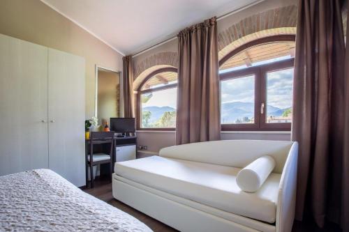 מיטה או מיטות בחדר ב-Il Fortino