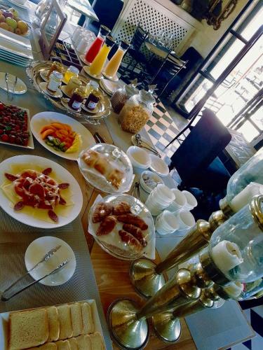 a table with plates of food on a table at Il Baglio sull'Acqua in Favignana