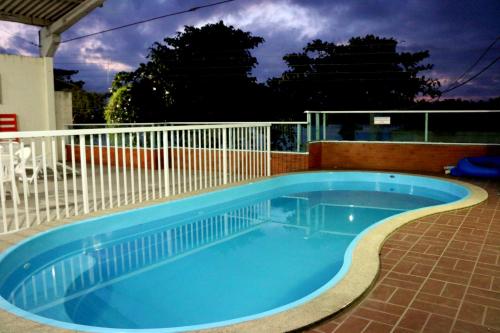 a small swimming pool on a patio at Pousada Solar das Conchas in Santa Cruz