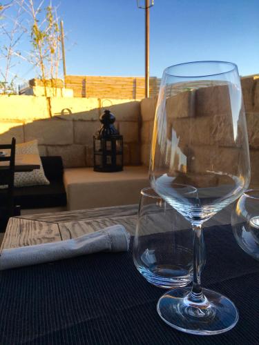 a wine glass sitting on top of a table at Il Baglio sull'Acqua in Favignana
