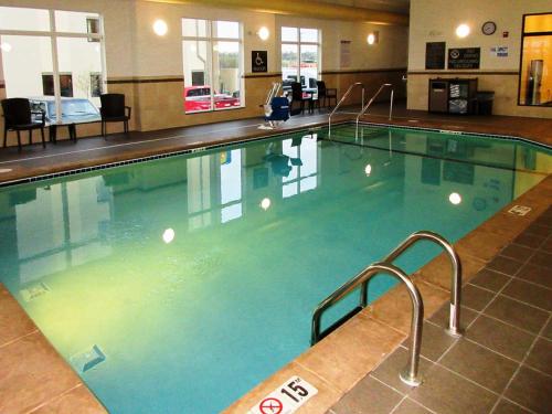 a large swimming pool in a hotel room at Sleep Inn & Suites West-Near Medical Center in Rochester
