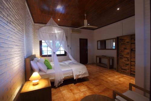 Postel nebo postele na pokoji v ubytování Amrita Maumere Resort