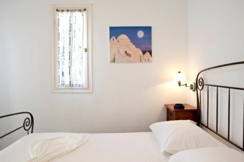 Postel nebo postele na pokoji v ubytování Alexandros Hotel