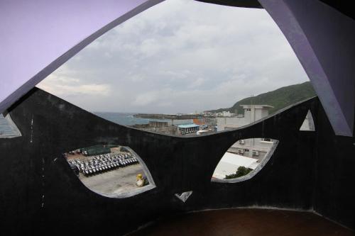 a view from the top of a building with a window at 綠島寧靜海潛水-城堡館 Twinkleocean diving hostel in Green Island