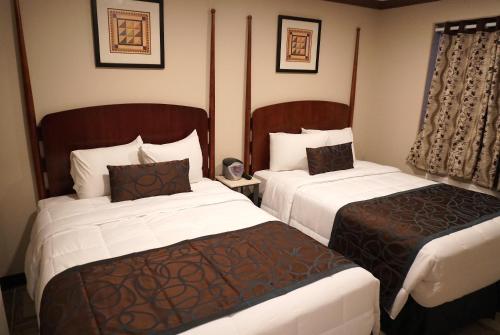 a hotel room with two beds in a room at Beachside Resort in Wildwood