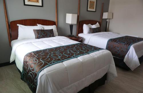 a hotel room with two beds in a room at Beachside Resort in Wildwood