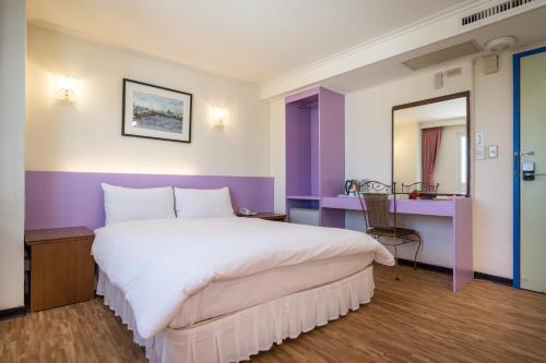 Postel nebo postele na pokoji v ubytování Apple Hotel