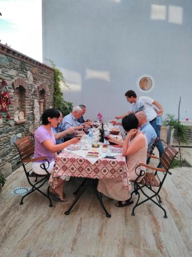 a group of people sitting at a table at Hotel Mary's House in Selcuk