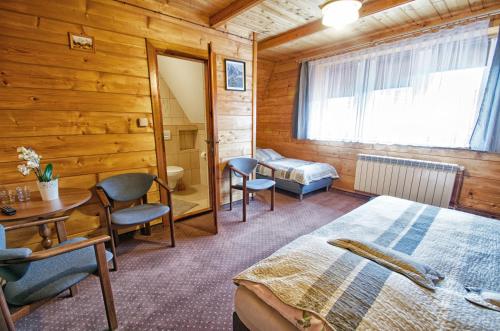 מיטה או מיטות בחדר ב-DOM WYPOCZYNKOWY ŻAK