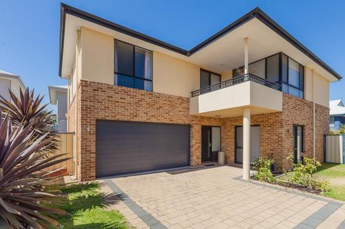 a brick house with a garage at The Lane, Doubleview in Perth