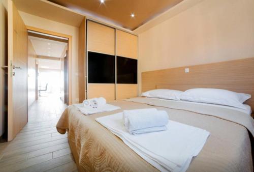 Katil atau katil-katil dalam bilik di Apartments Dalmacija Tučepi