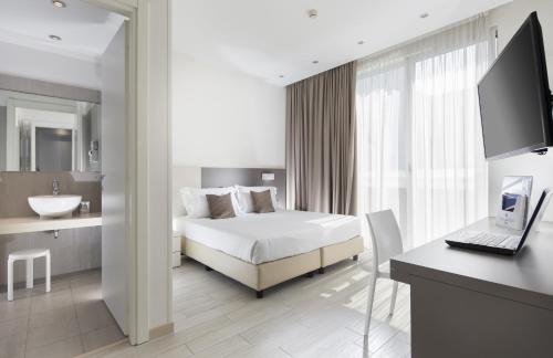 Postel nebo postele na pokoji v ubytování Hotel Cube