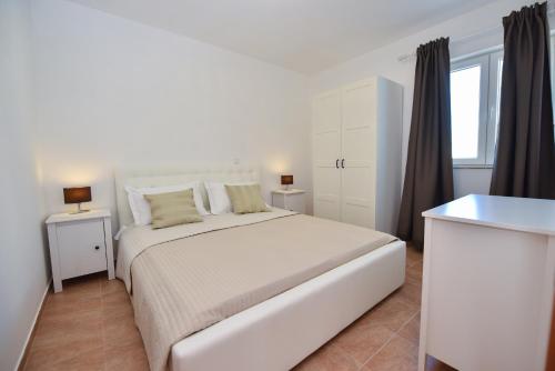Giường trong phòng chung tại Villa Ivanovi Dvori