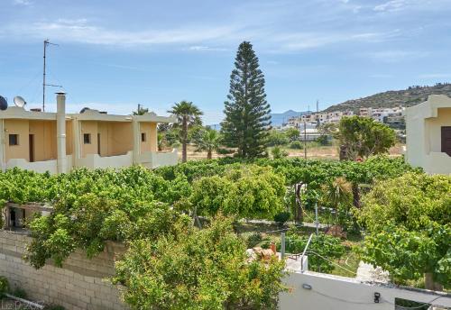 a view from the roof of a house with trees at Dimitra Apartments in Sitia