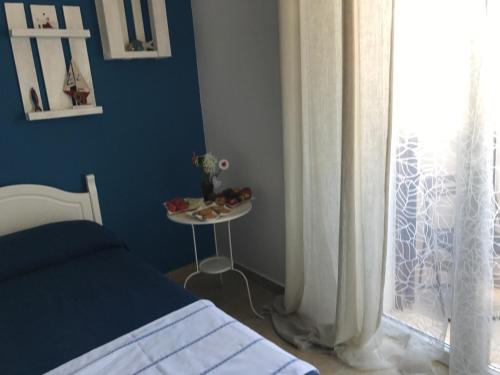 Ένα ή περισσότερα κρεβάτια σε δωμάτιο στο La Maison de Gabrielè