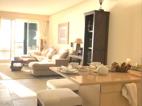 a living room with a couch and a table at Paradise Beach in Porto Santo