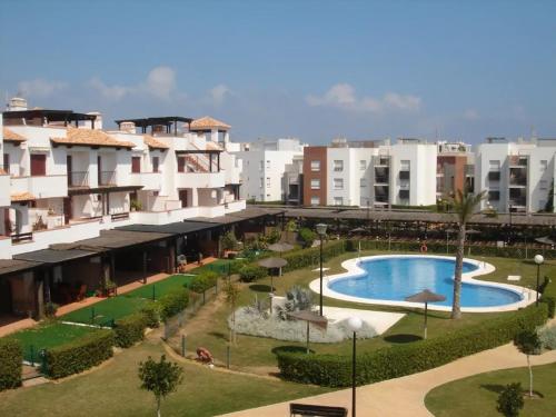 arial view of a resort with a pool and buildings at Apartamento MPS Jardines de Nuevo Vera in Vera