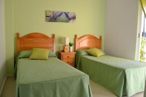 En eller flere senger på et rom på Faro 1 LOCDENIA