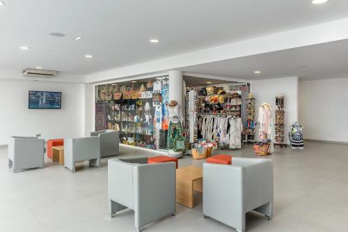 a store with several tables and chairs in a room at Hotel Vibra Mare Nostrum in Playa d'en Bossa