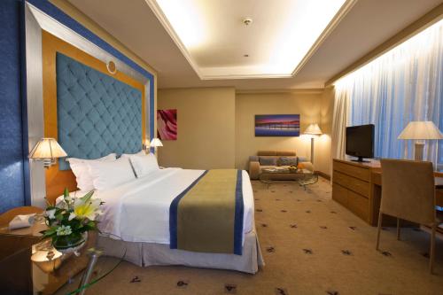 Ένα ή περισσότερα κρεβάτια σε δωμάτιο στο Social Hotel