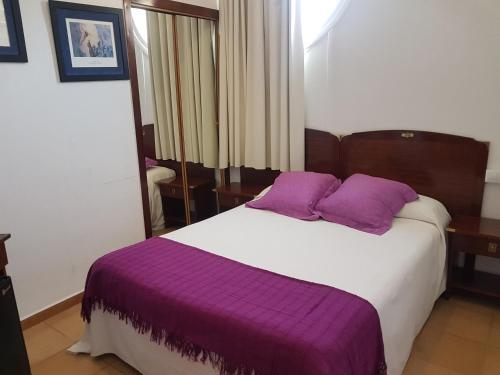 Ένα ή περισσότερα κρεβάτια σε δωμάτιο στο Hotel La Residencia
