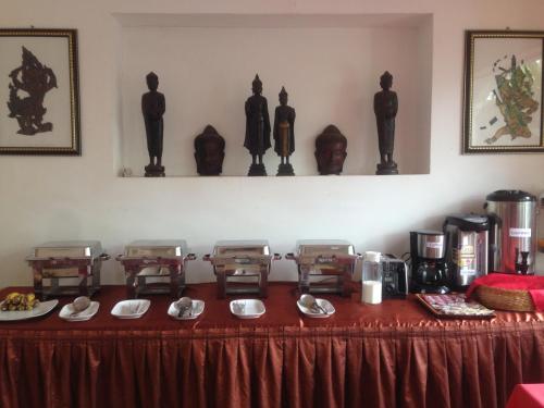 a table with plates of food on top of it at King Boutique Hotel in Siem Reap