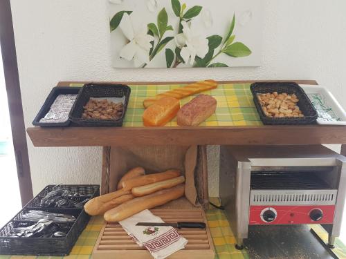 a table with different types of food on it at Summer Village of Hippokrates - Adults only in Marmari