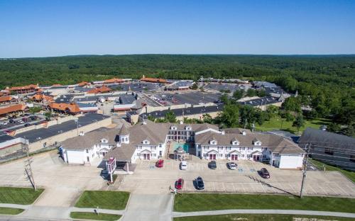 an aerial view of a large building with a parking lot at Osage Village Inn in Osage Beach