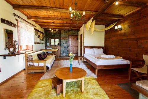 a living room with a bed and a table at Arxontiko Agonari in Metamorfosi