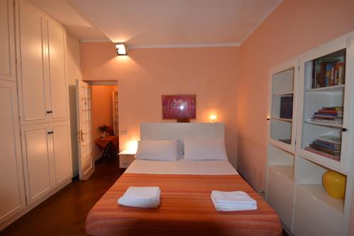 a bedroom with a bed with two towels on it at B&B A Casa Di Nancy in Rome