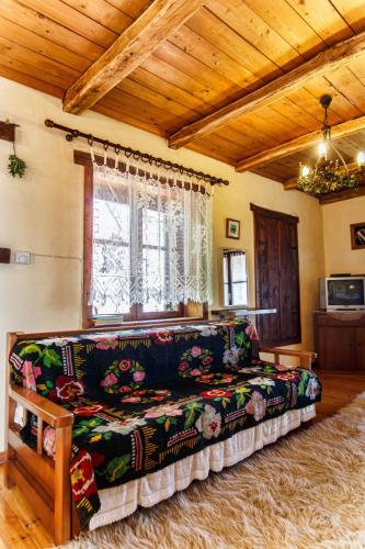 a living room with a couch and a window at Arxontiko Agonari in Metamorfosi