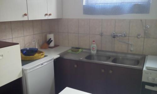 Kuchyňa alebo kuchynka v ubytovaní Apartment Neo