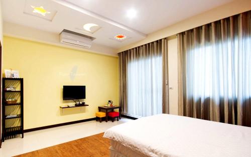 Katil atau katil-katil dalam bilik di Outingfun Bed and Breakfast