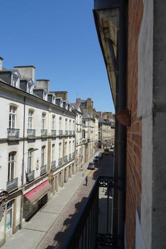 a view from a window of a street with buildings at Le Quatre in Rennes