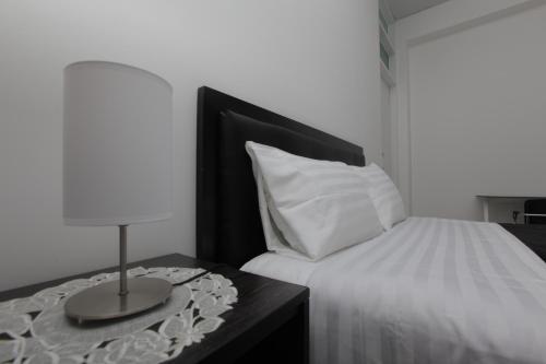 Postel nebo postele na pokoji v ubytování Hotel Murano