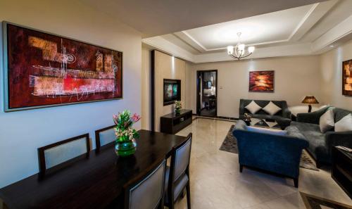 a living room with a couch and a table at Boudl Al Woroud بودل الورود in Riyadh