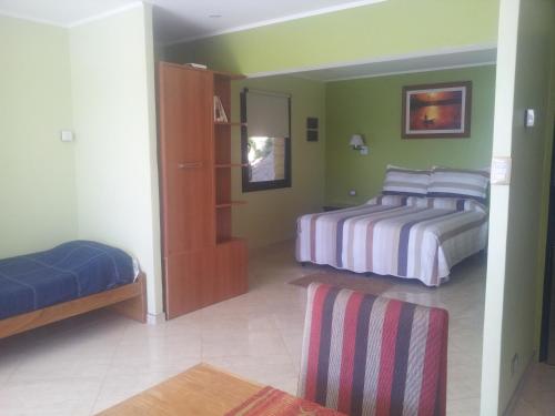 Postel nebo postele na pokoji v ubytování Apart Hotel La Busqueda