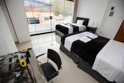 Postel nebo postele na pokoji v ubytování Hotel Murano