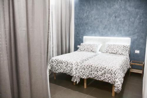 a bed and a chair in a room at B&B Regina ELENA in Campobasso