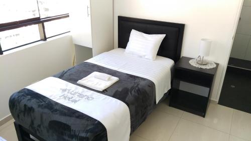 Postel nebo postele na pokoji v ubytování Hotel Murano