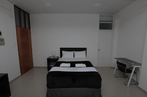 Postel nebo postele na pokoji v ubytování Hotel Murano