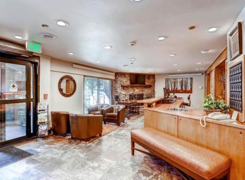 a lobby with a bar and a living room at GetAways at Falcon Point Resort in Avon