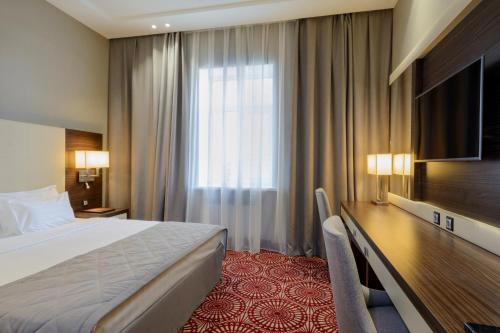 Postel nebo postele na pokoji v ubytování Hotel Senator