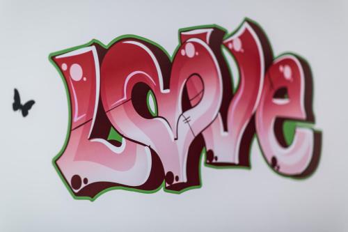 a drawing of the word pray with a bird at Villa Maria in Turin