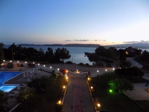 a view of a street at night with a pool at Galaxy Hotel in Argostoli