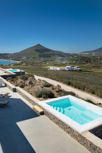 a swimming pool on top of a building at Natura Villas Paros in Molos Parou