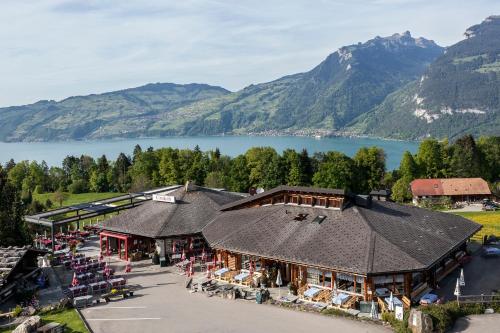 an overhead view of a building with a lake and mountains at Chemihütte in Aeschi