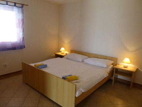 Postel nebo postele na pokoji v ubytování Apartments Villa Rosmarin