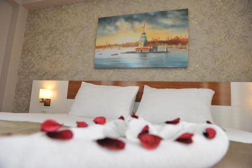 Ένα ή περισσότερα κρεβάτια σε δωμάτιο στο Qamar Prestige Suites